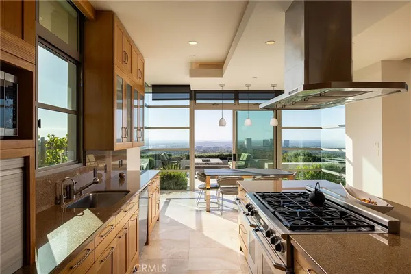 a kitchen with counter top space and appliances