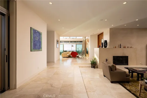 a bedroom with a bed and a glass top table