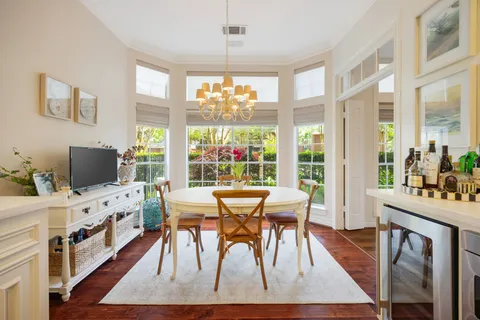 a white stove top oven sitting inside of a kitchen