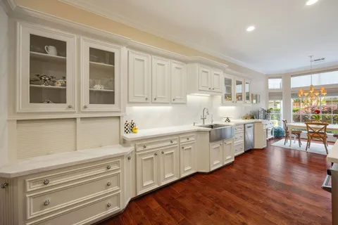a spacious bedroom with a bed and a flat screen tv