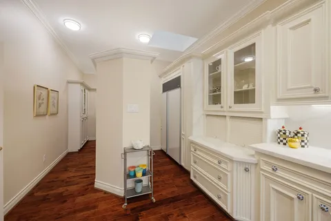 a spacious en suite bathroom with a tub shower and mirror