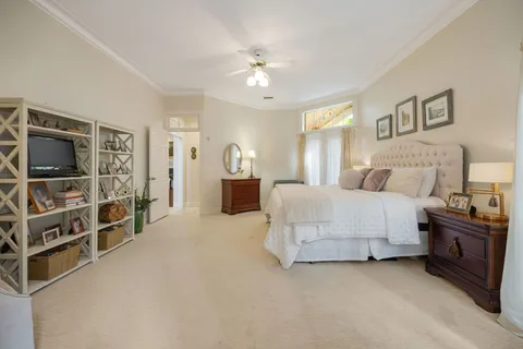 a bedroom with a bed and a cabinets