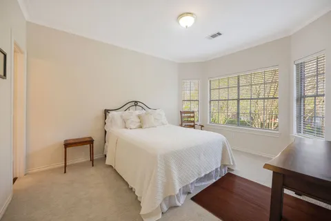 a view of yard with swimming pool and green space