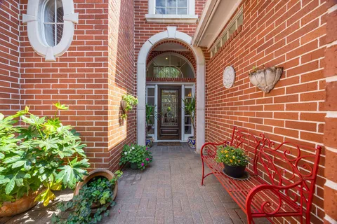 a living room with furniture a dining table and a fireplace