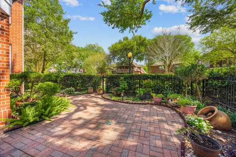 an aerial view of residential houses with outdoor space and river