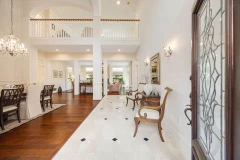 a living room with fireplace furniture and a fireplace