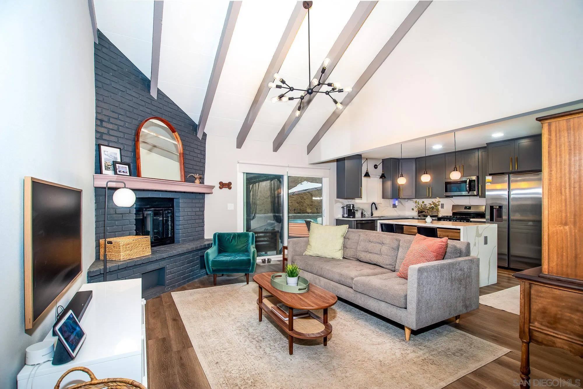 a living room with fireplace furniture and a flat screen tv