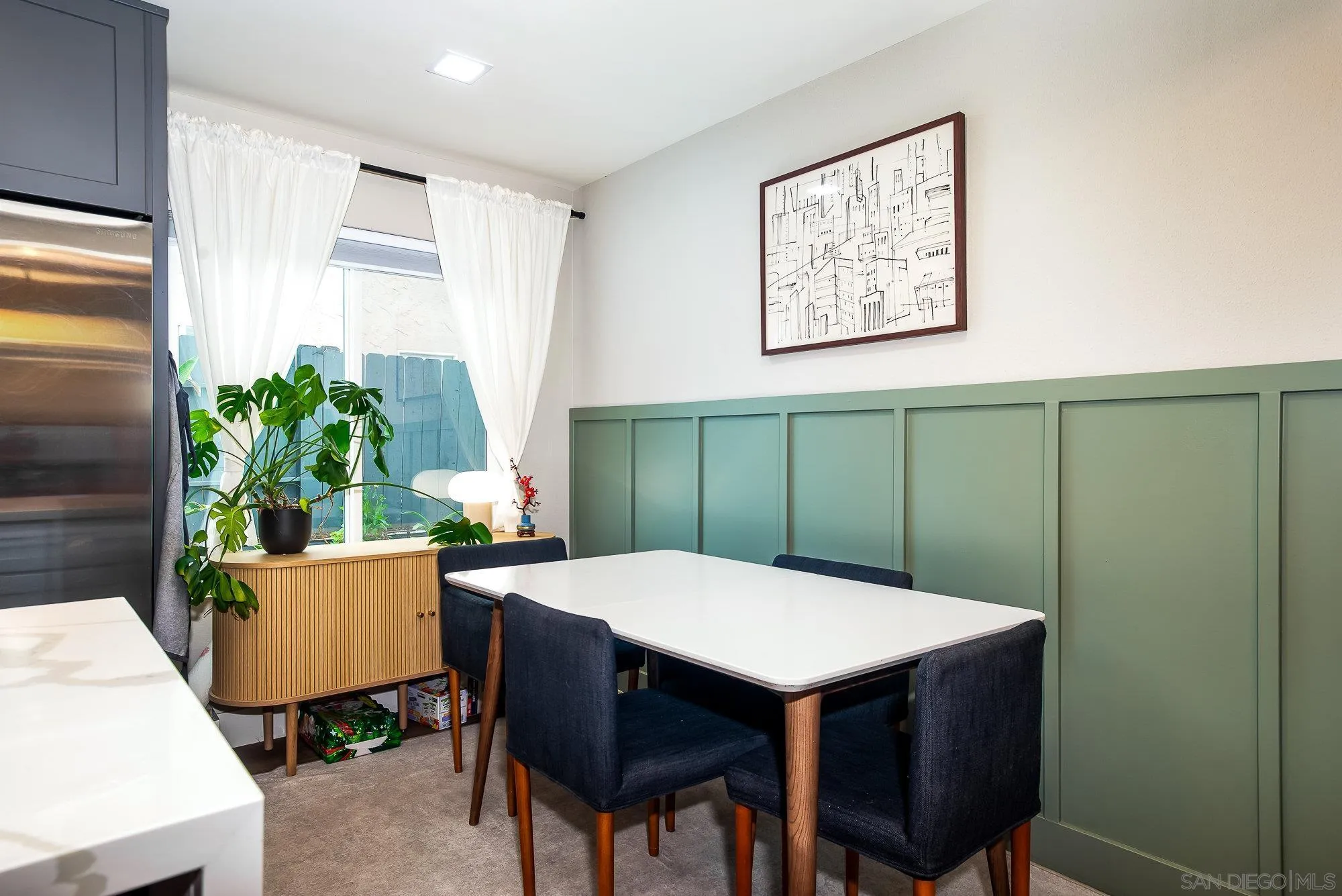10753 Valor Place Santee, CA 92071 - Photo 11 of 24 a view of a dining room with furniture and a potted plant