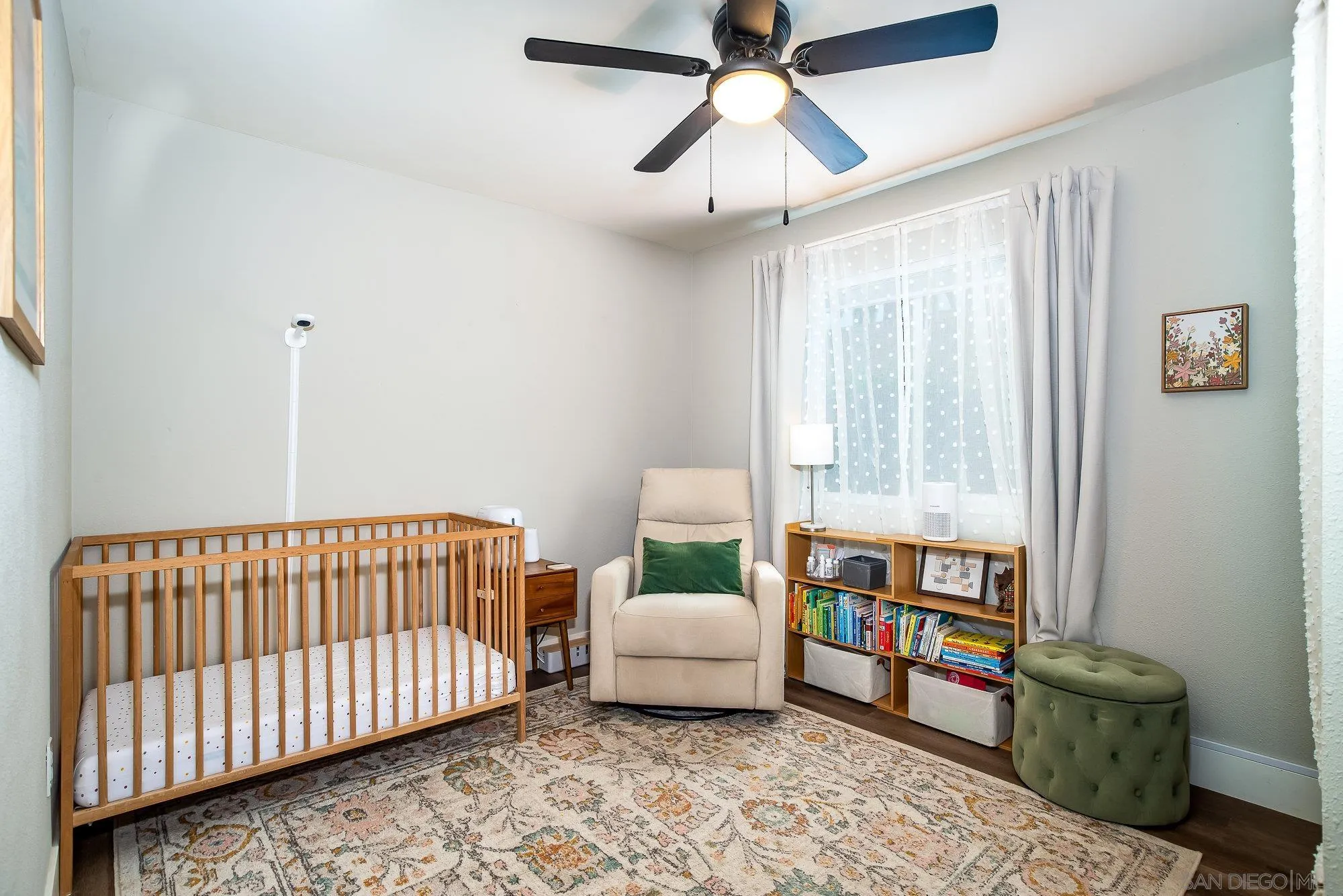 10753 Valor Place Santee, CA 92071 - Photo 16 of 24 a bedroom with a bed and a book shelf