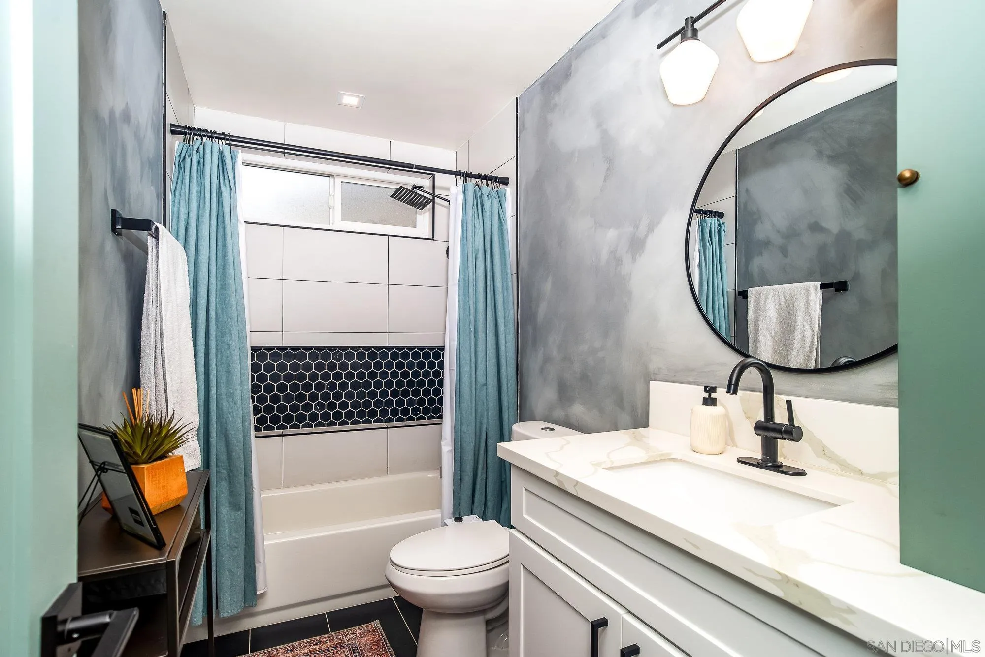 10753 Valor Place Santee, CA 92071 - Photo 18 of 24 a bathroom with a sink a toilet and a mirror