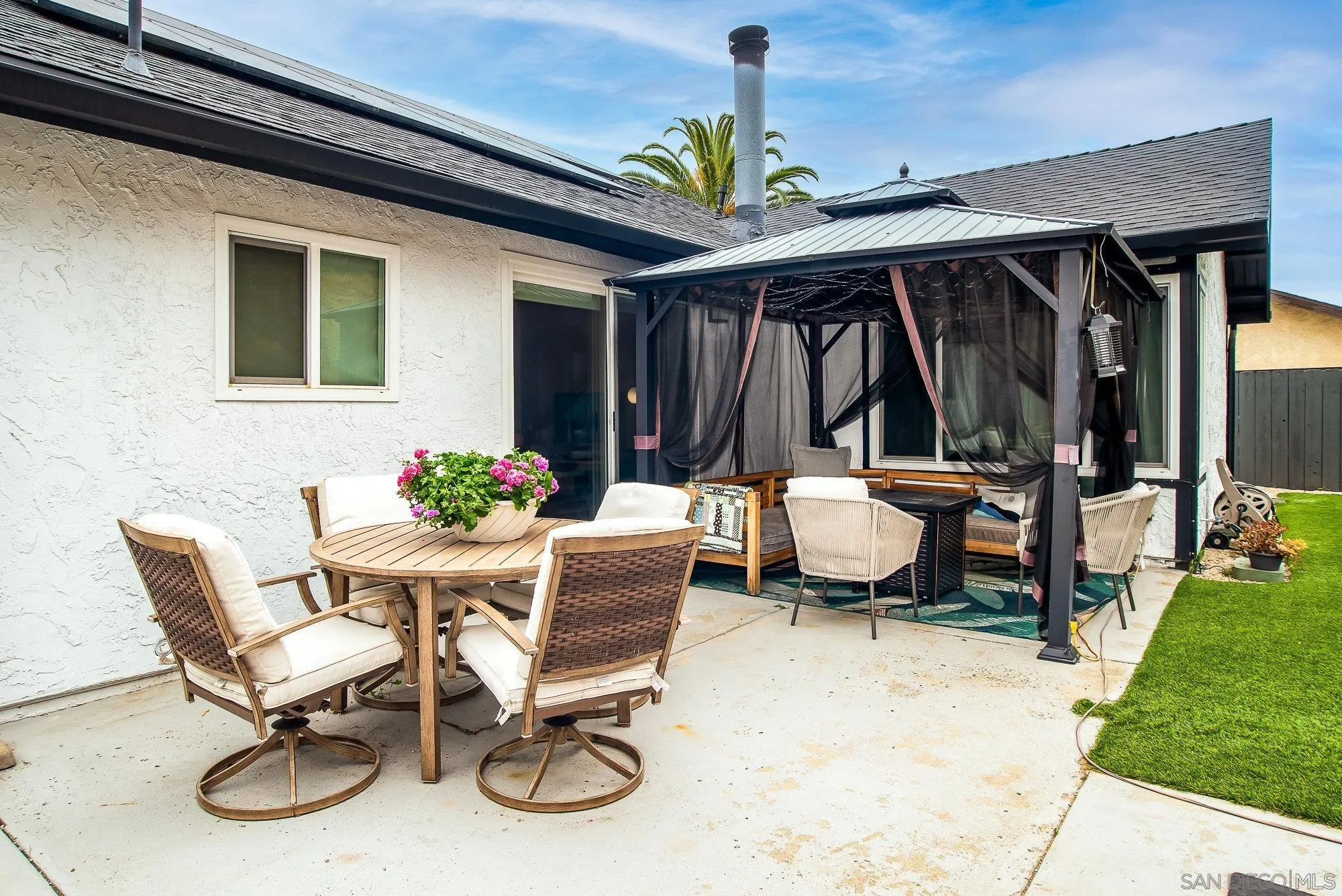 10753 Valor Place Santee, CA 92071 - Photo 21 of 24 a view of a backyard with a patio and outdoor seating