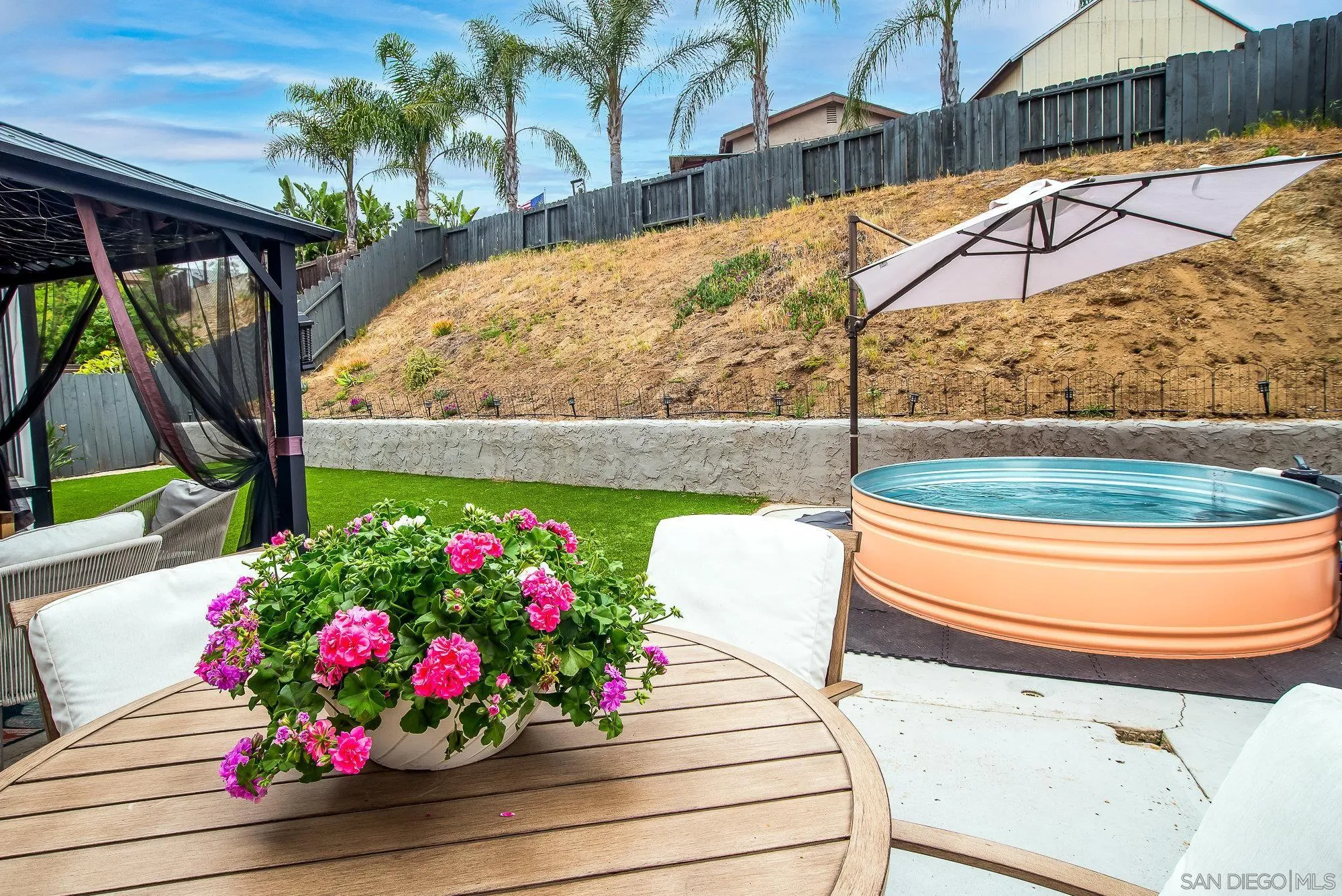 10753 Valor Place Santee, CA 92071 - Photo 23 of 24 a wooden bench sitting in front of a building