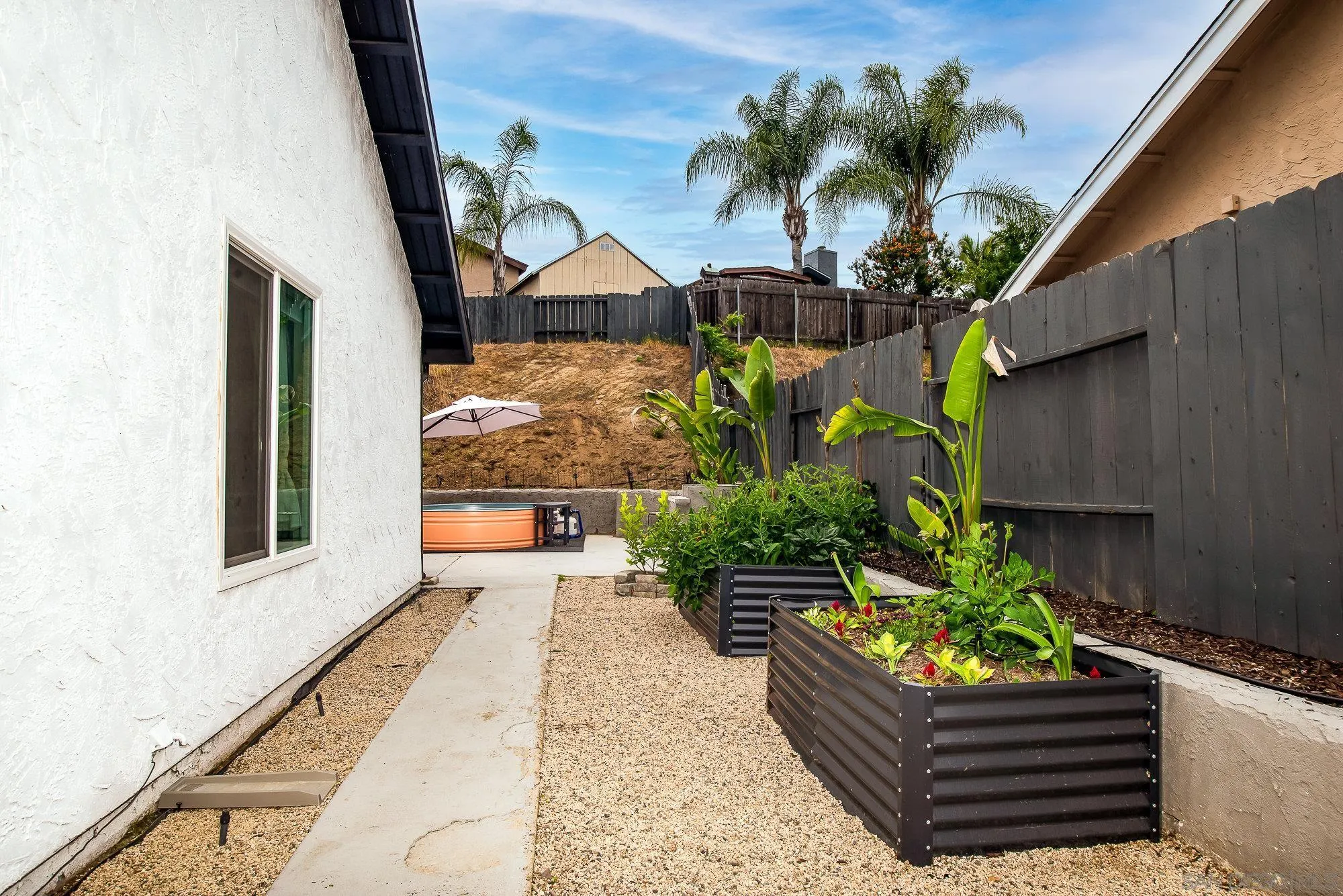10753 Valor Place Santee, CA 92071 - Photo 24 of 24 a front view of a house with a garden