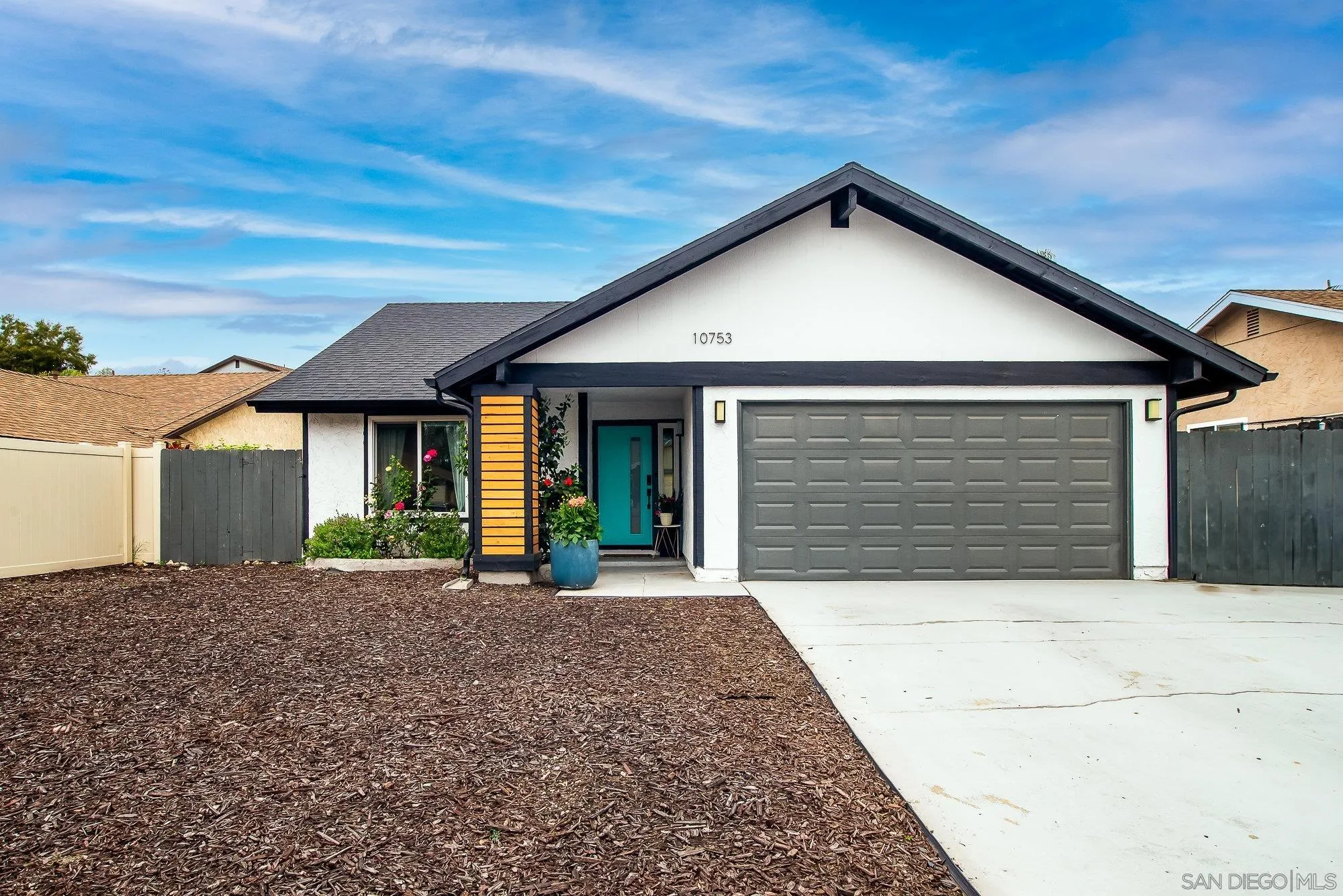 10753 Valor Place Santee, CA 92071 - Photo 3 of 24 a front view of a house with a yard