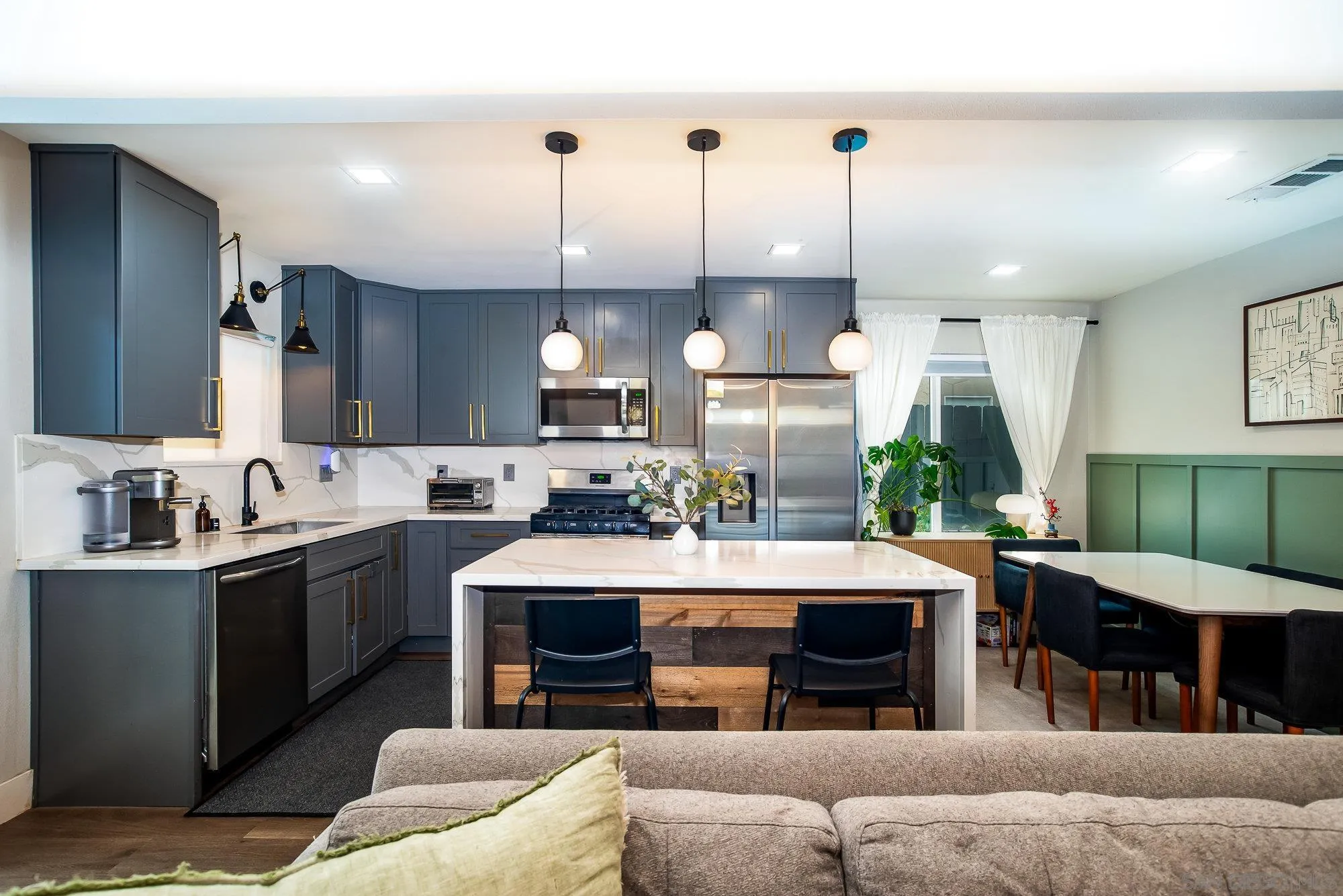 10753 Valor Place Santee, CA 92071 - Photo 8 of 24 a large kitchen with a table and chairs