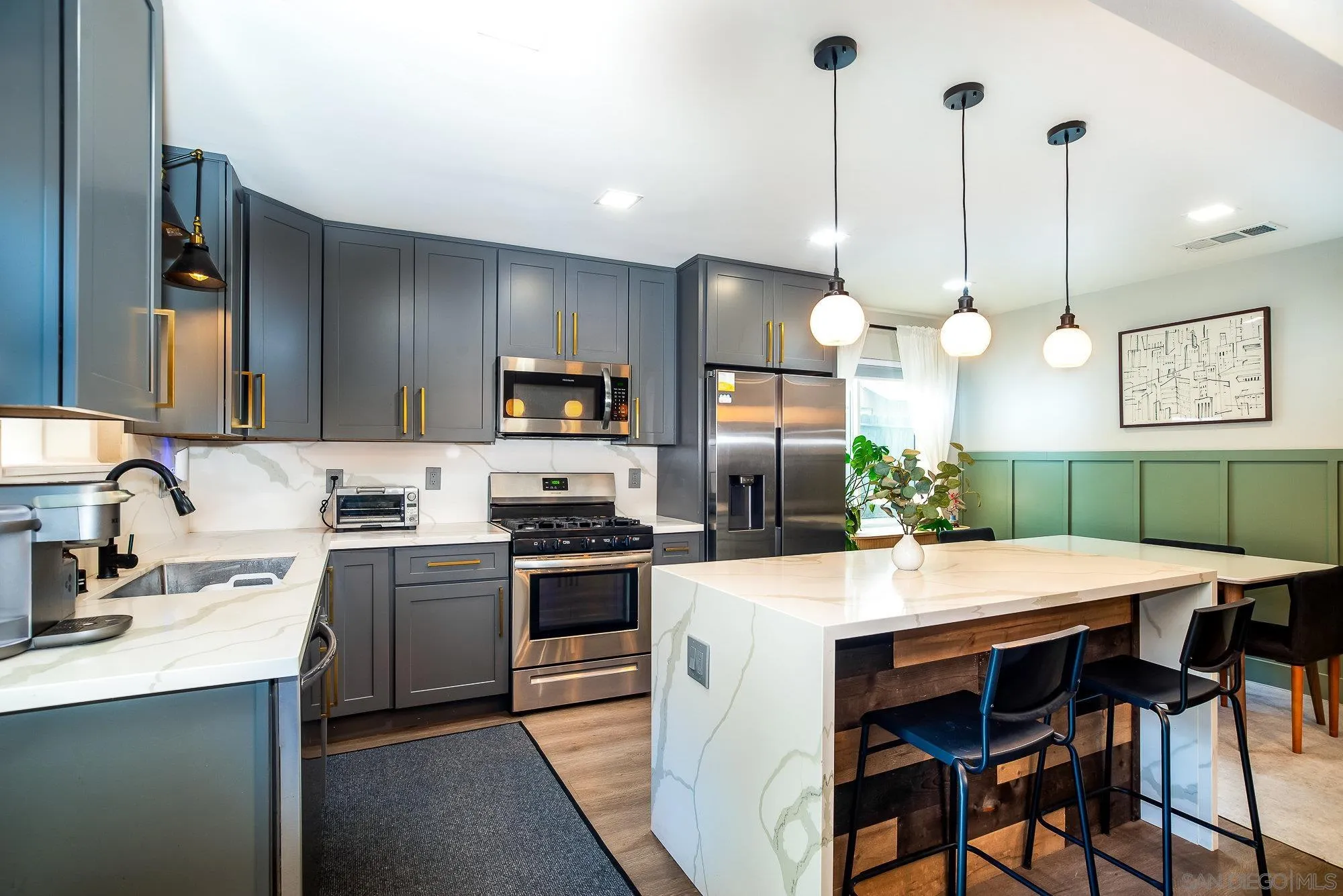 10753 Valor Place Santee, CA 92071 - Photo 9 of 24 a kitchen with cabinets a sink and appliances