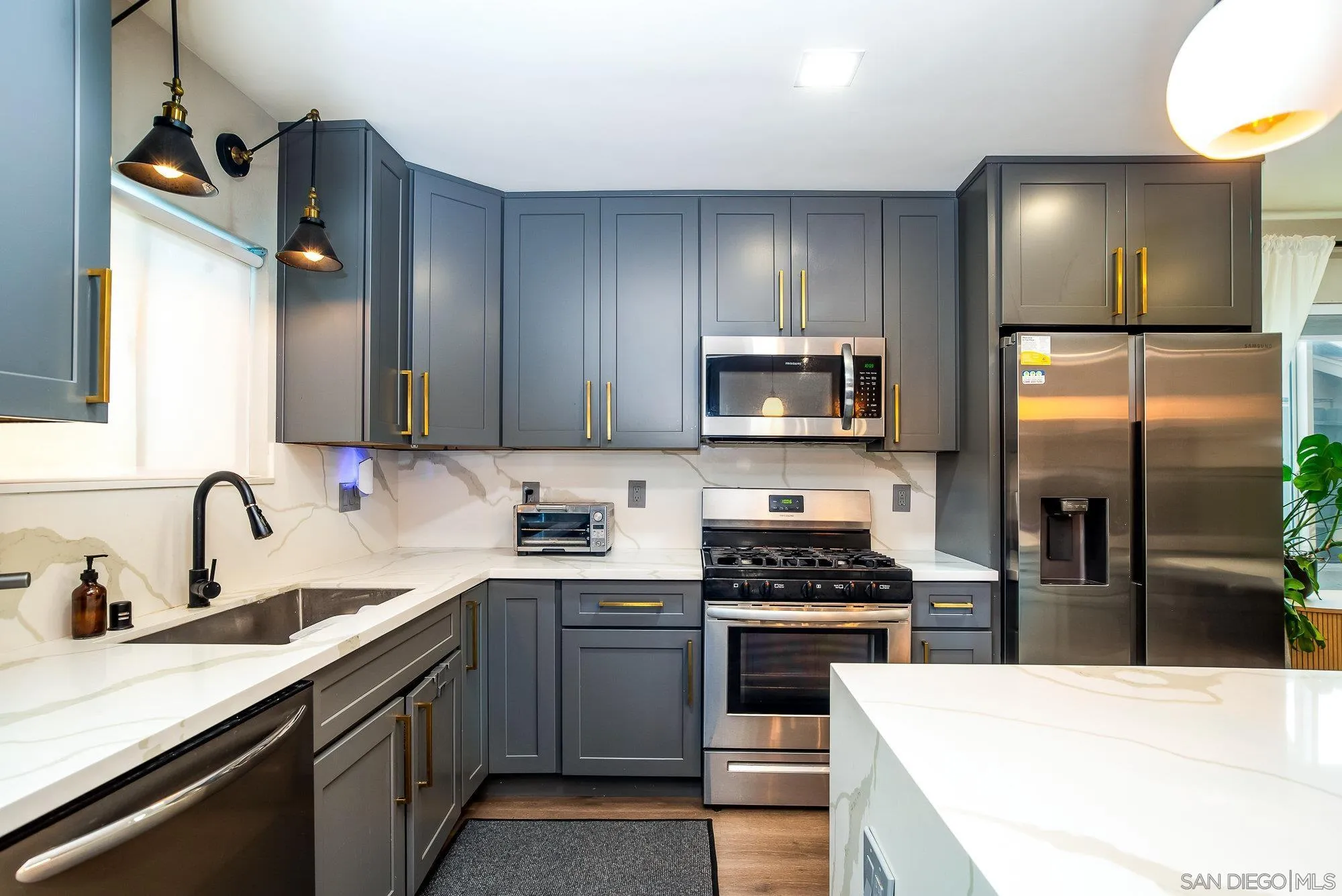 10753 Valor Place Santee, CA 92071 - Photo 10 of 24 a kitchen with a sink appliances and cabinets