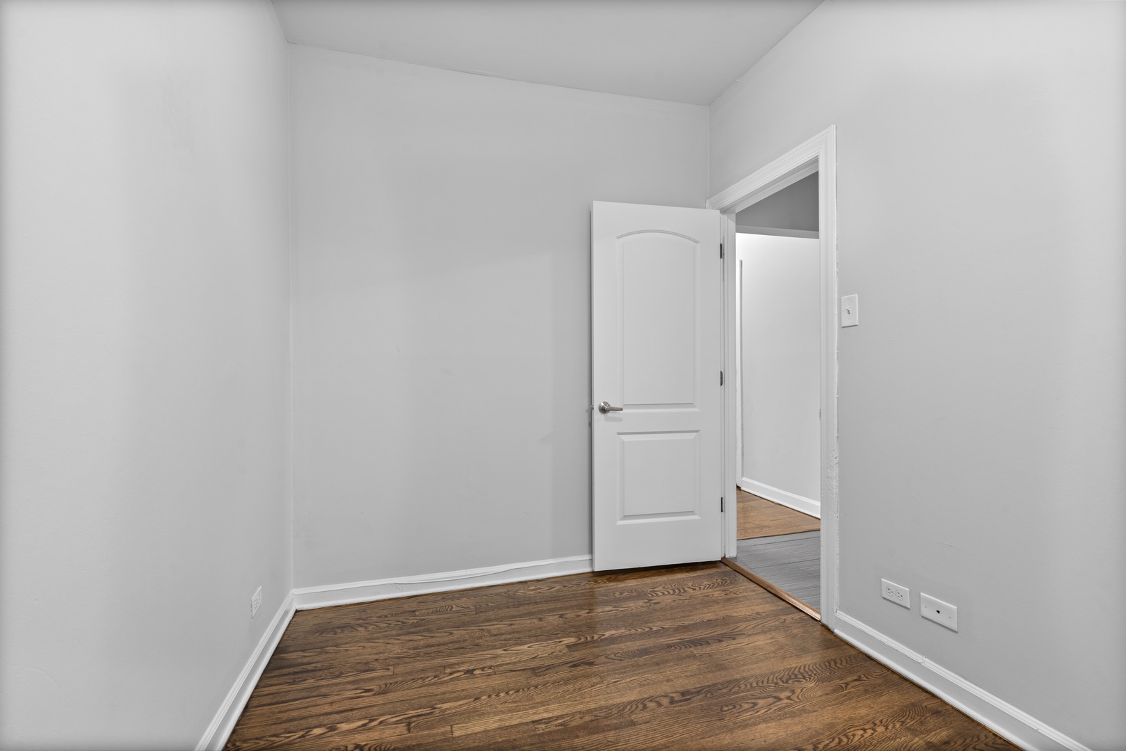 1724 West Juneway Terrace, Unit 3A Chicago, IL 60626 - Photo 8 of 9 a view of an empty room with closet and wooden floor