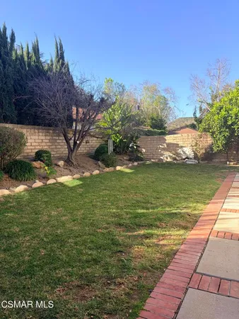a view of a lake with a big yard