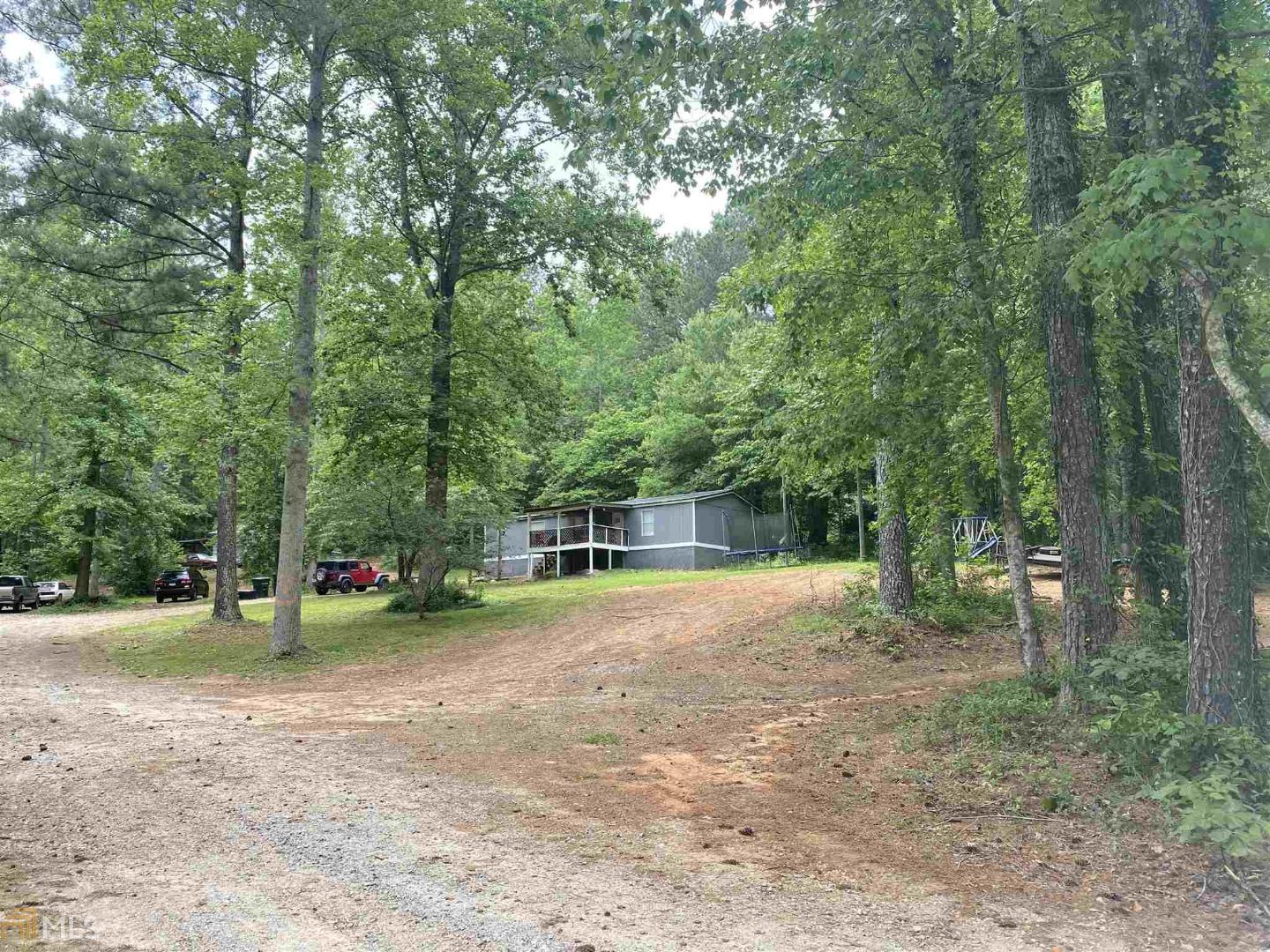 a view of outdoor space with trees all around