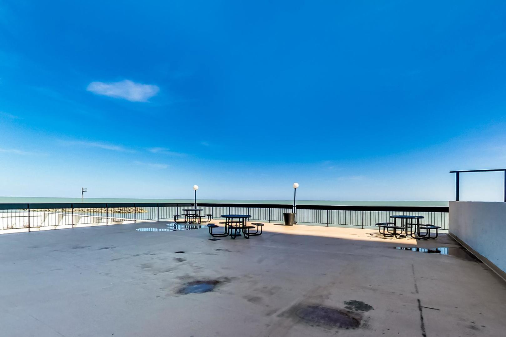 5901 North Sheridan Road, Unit 6K Chicago, IL 60660 - Photo 35 of 39 a view of a swimming pool and an outdoor seating