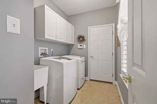 a bedroom with a bed a window and closet