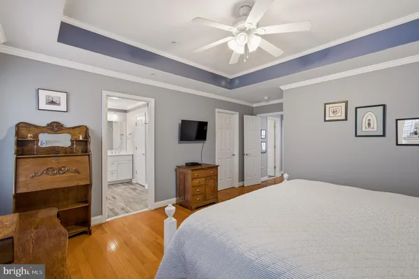 a living room with furniture and a ceiling fan