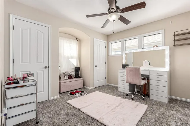 a bedroom with furniture and a chandelier