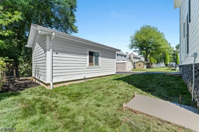 a view of a back yard of the house