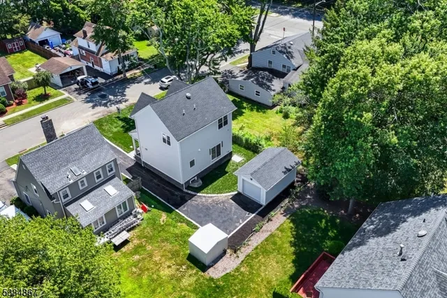 an aerial view of a house with a garden