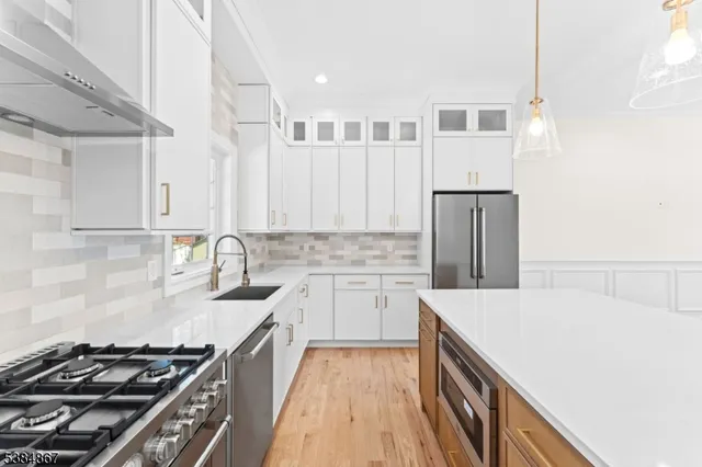 a kitchen with a stove and a sink