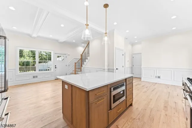 a kitchen that has a lot of cabinets in it