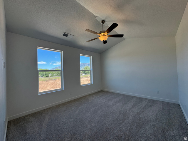 1472 North 1875 West, Unit 151 Layton, UT 84041 - Photo 15 of 20 Spacious room featuring vaulted ceilings and a ceiling fan with integrated lighting