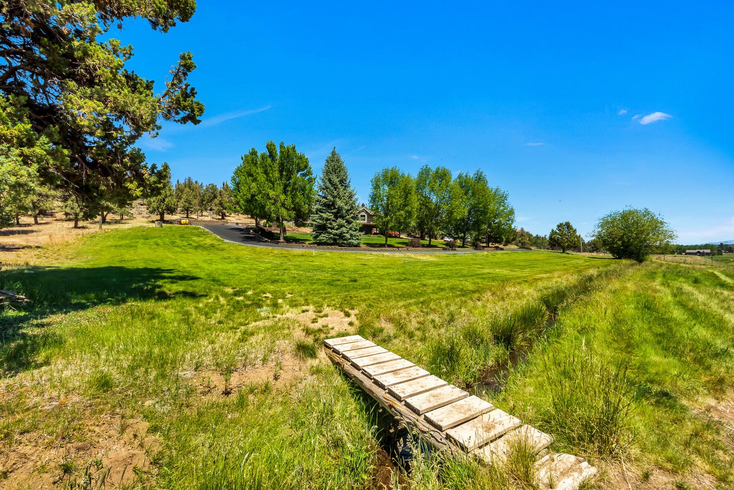 19310 Dayton Road Bend, OR 97703 - Photo 26 of 40 Irrigation canal runs through property.