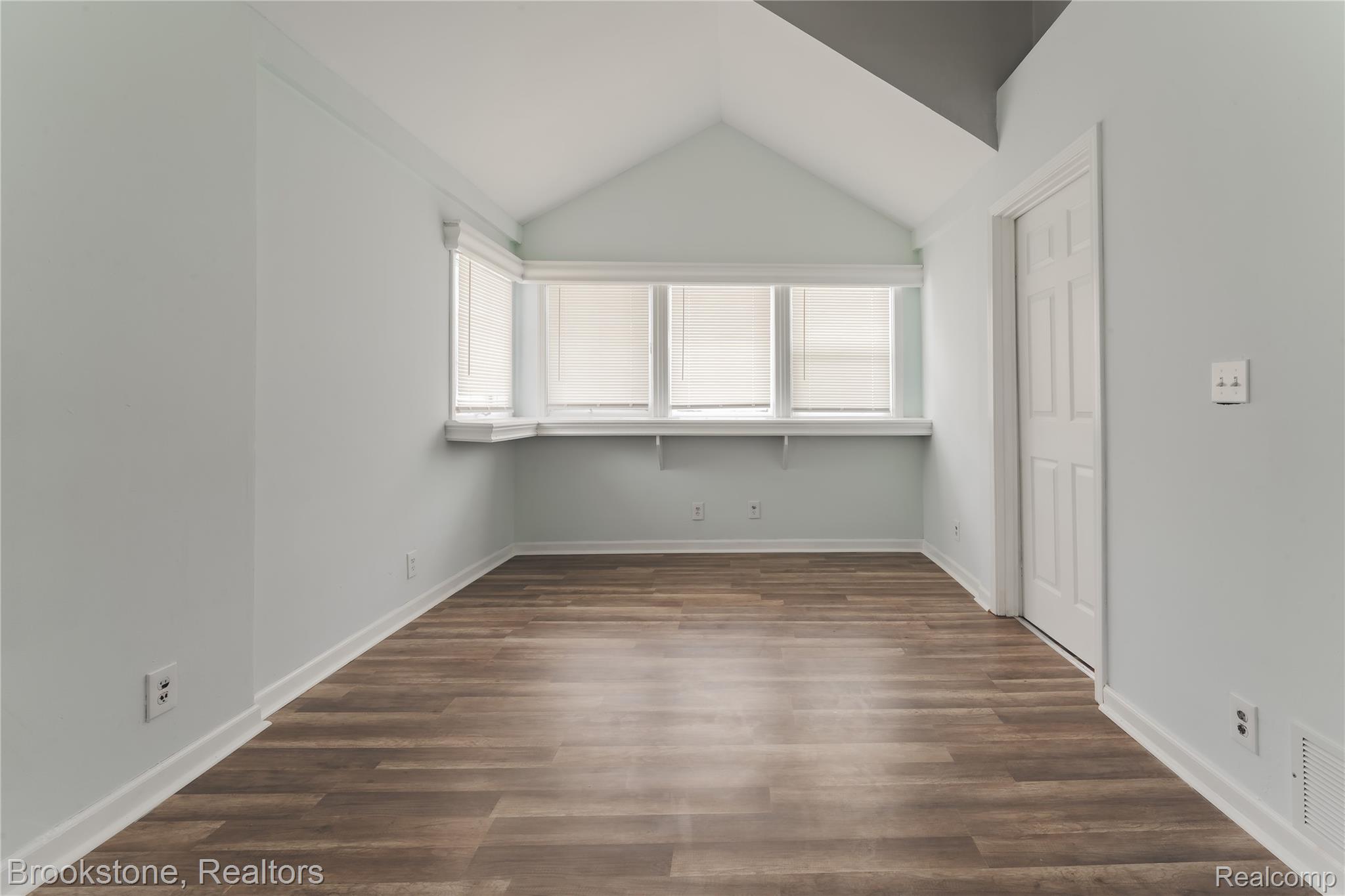 202 West Rundell Street Pontiac, MI 48342 - Photo 14 of 27 Primary Bedroom with dark wood finished floors and baseboards