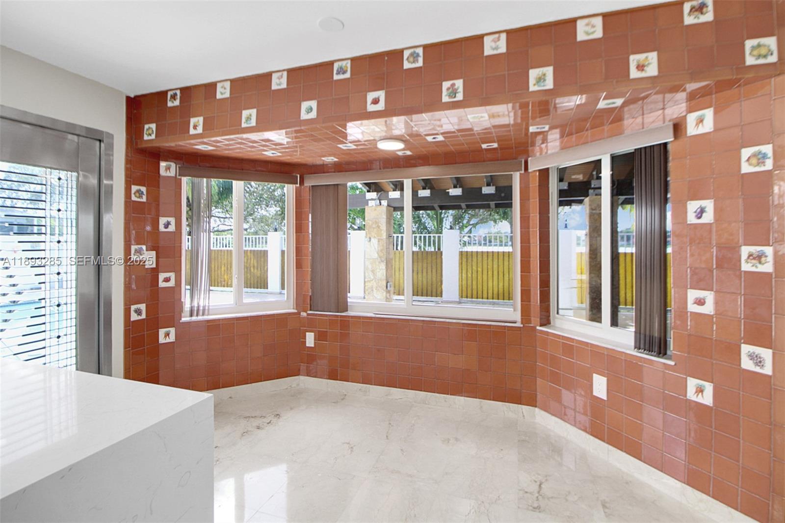 8416 Northwest 201st Street Hialeah, FL 33015 - Photo 12 of 40 This is the breakfast area with a view to the pool, deack and lake.