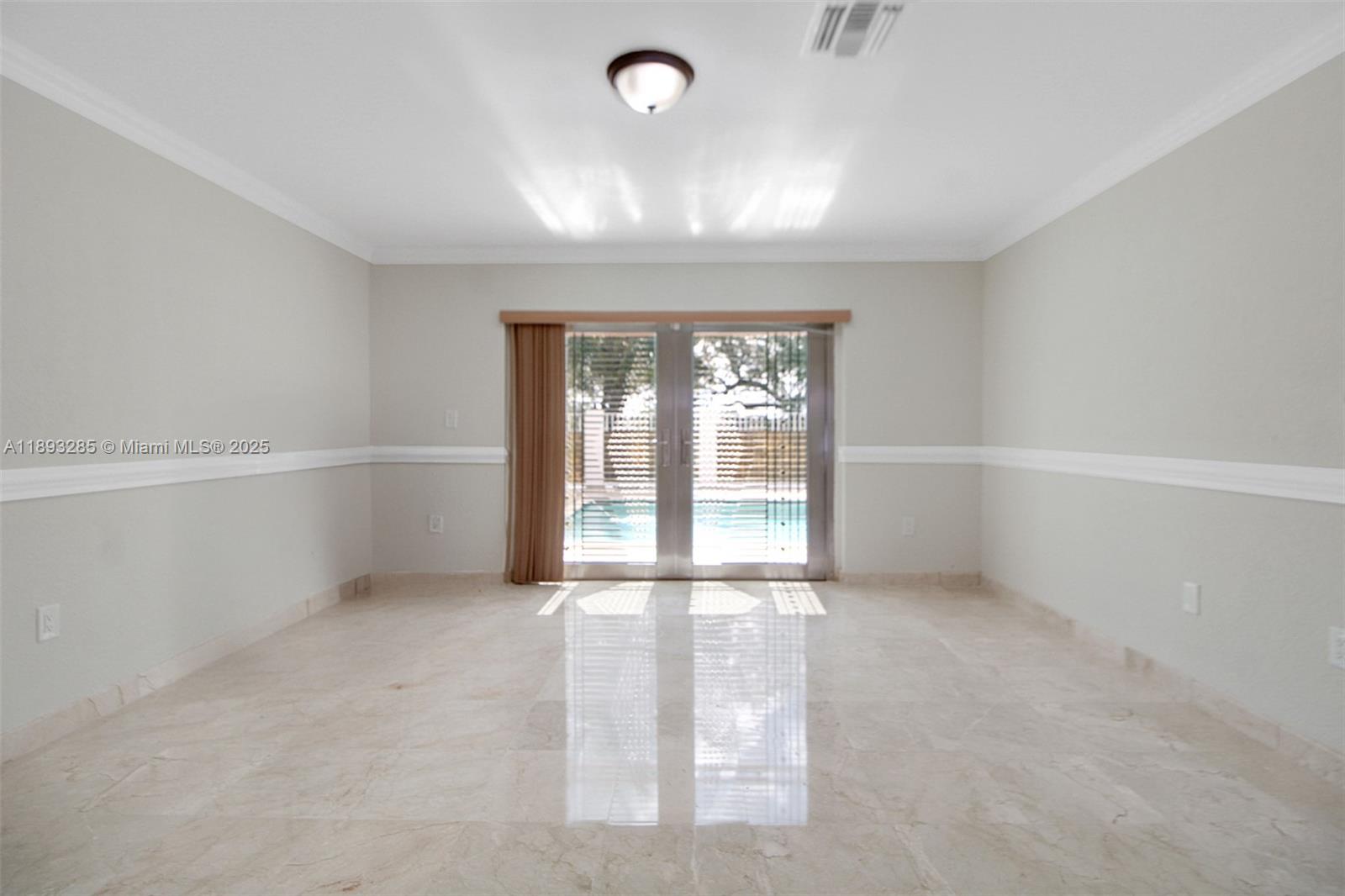 8416 Northwest 201st Street Hialeah, FL 33015 - Photo 19 of 40 This primary bedroom has access to the pool deck.