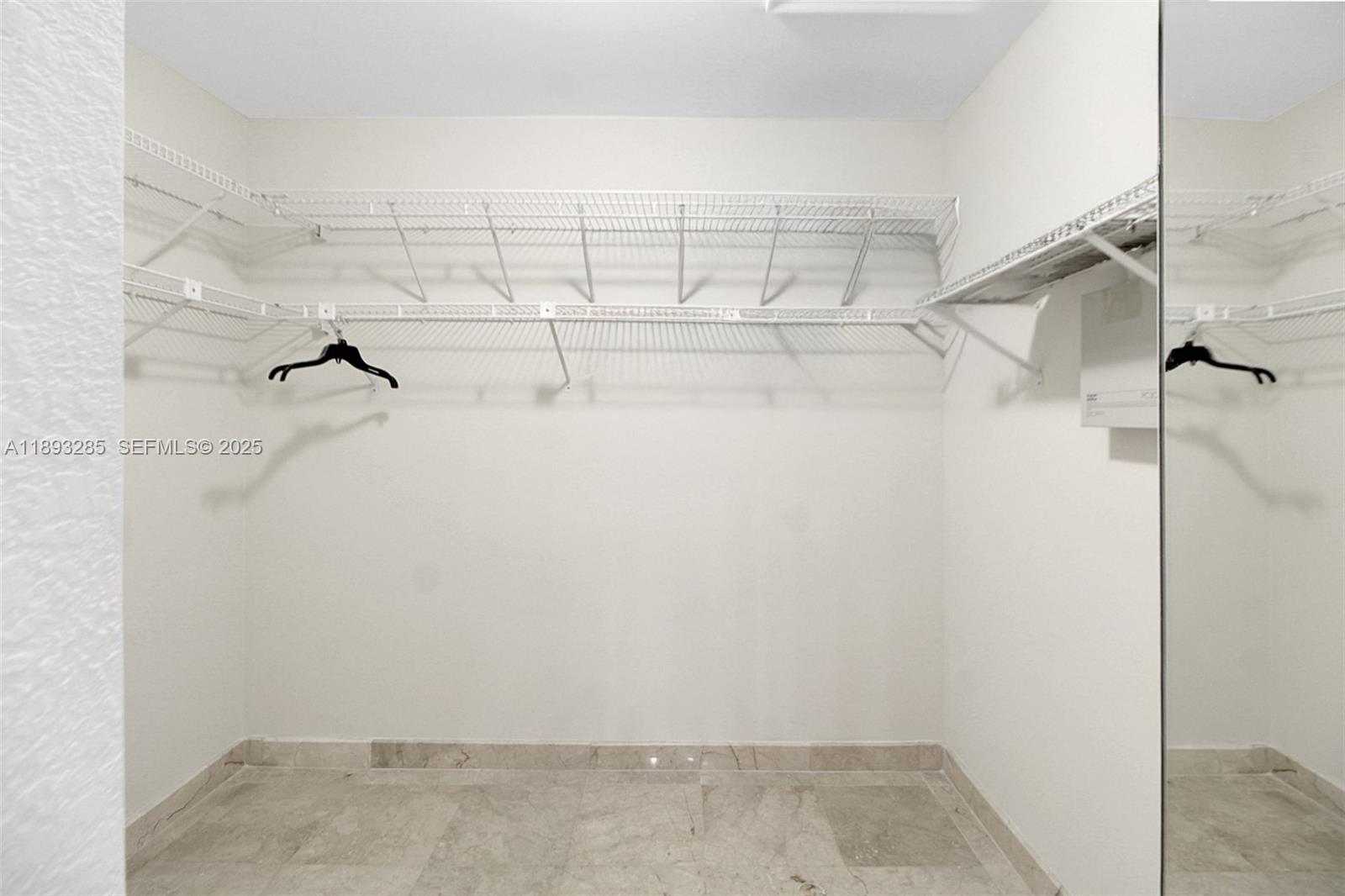 8416 Northwest 201st Street Hialeah, FL 33015 - Photo 25 of 40 Primary bedroom closet.