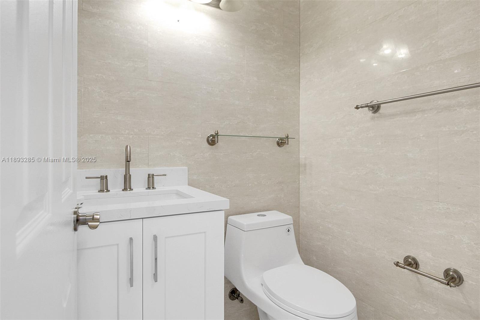 8416 Northwest 201st Street Hialeah, FL 33015 - Photo 27 of 40 There two bathrooms upstairs. This is one of them.