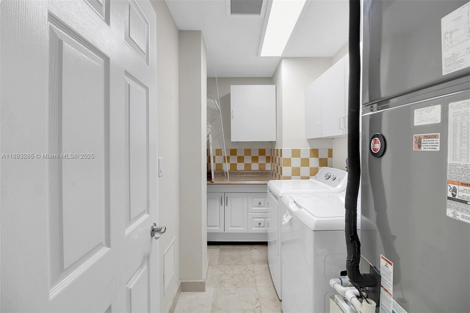 8416 Northwest 201st Street Hialeah, FL 33015 - Photo 31 of 40 Indoor laundry room located on the first floor.