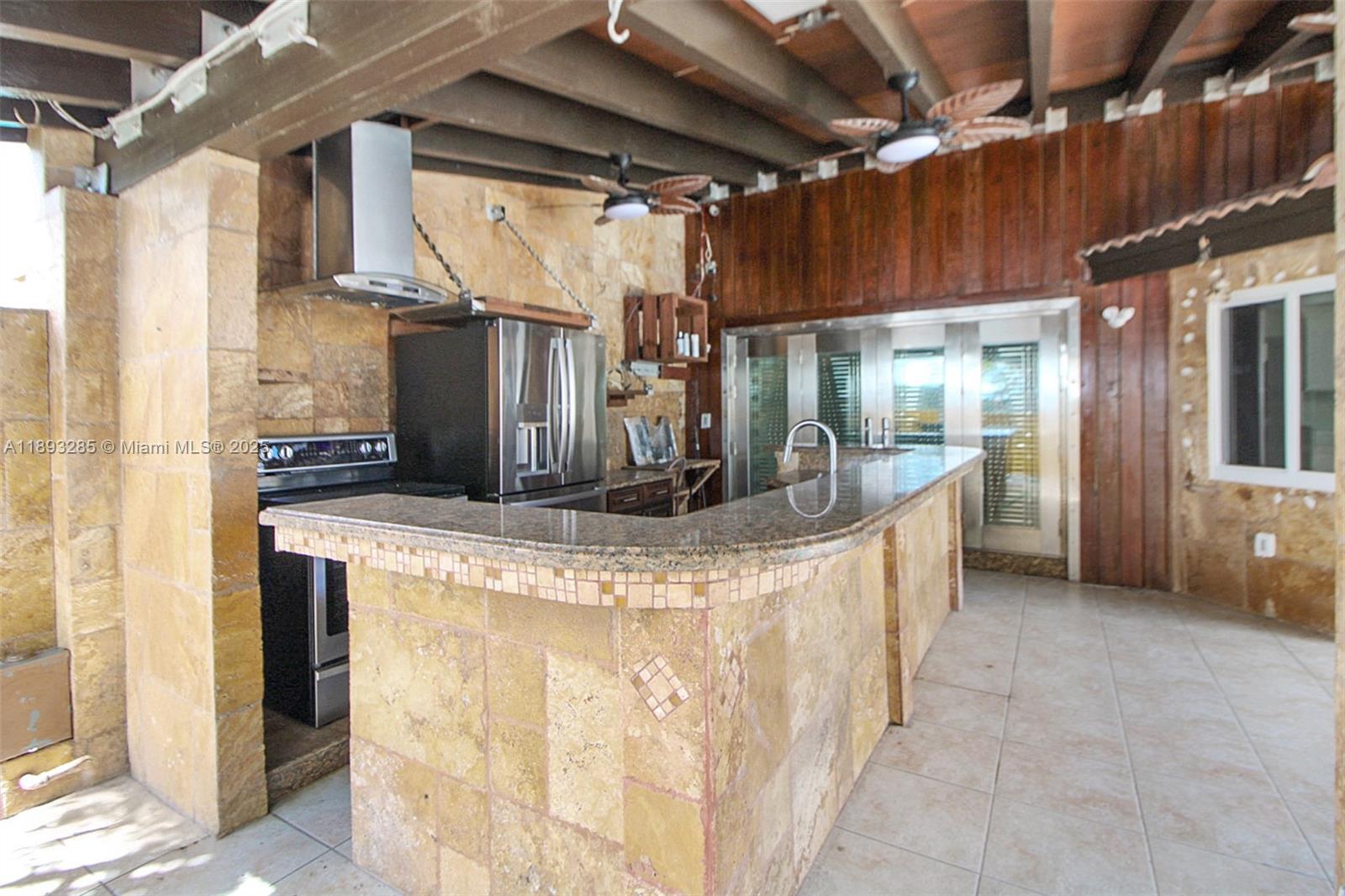 8416 Northwest 201st Street Hialeah, FL 33015 - Photo 37 of 40 Outdoor kitchen with full size appliances, full size sink. Plus, gas hook-up ready for use if desired.