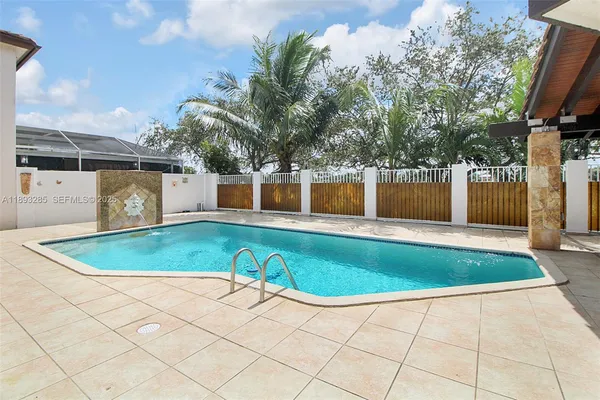 a view of outdoor space and swimming pool