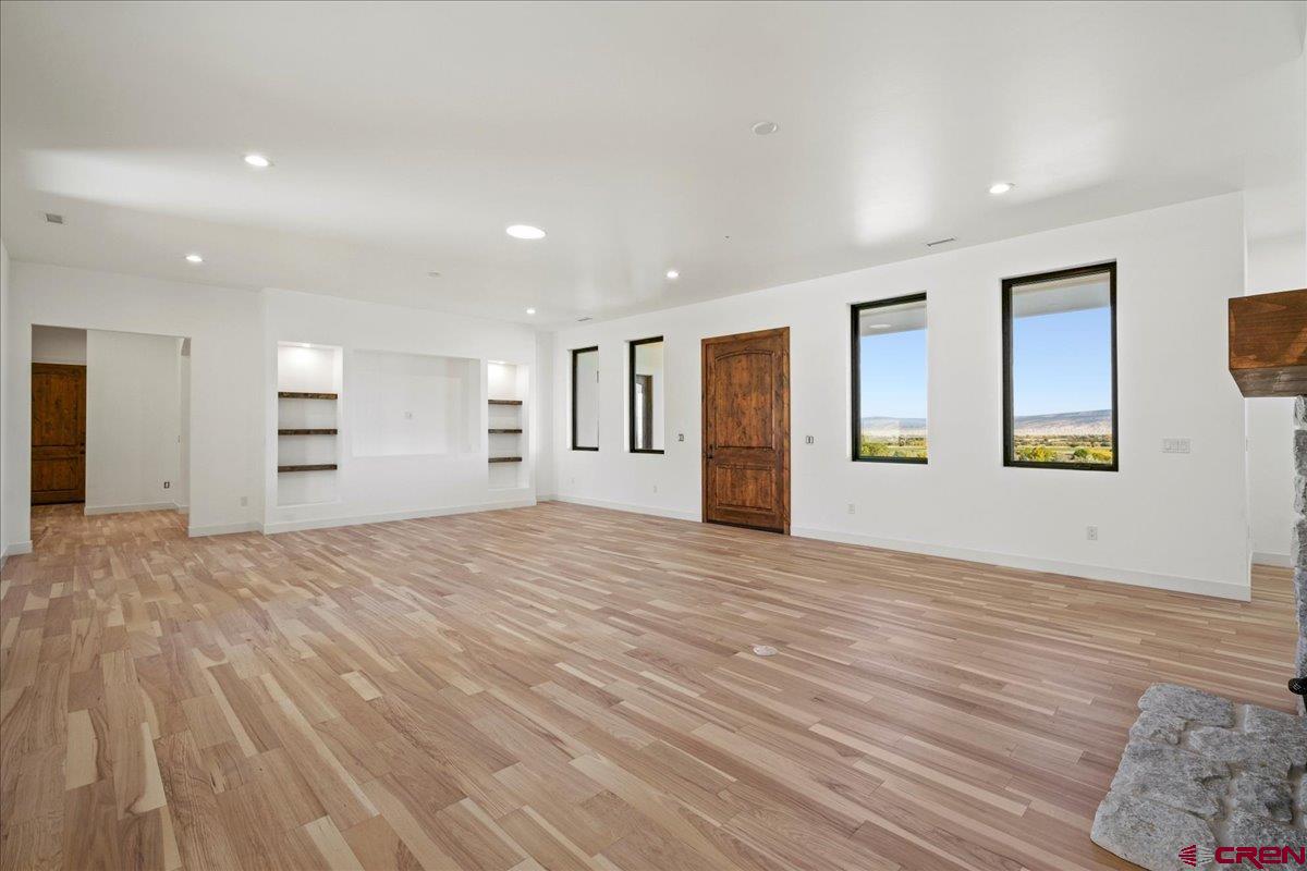 14447 5950 Road Montrose, CO 81403 - Photo 11 of 45 a view of empty room with kitchen and window