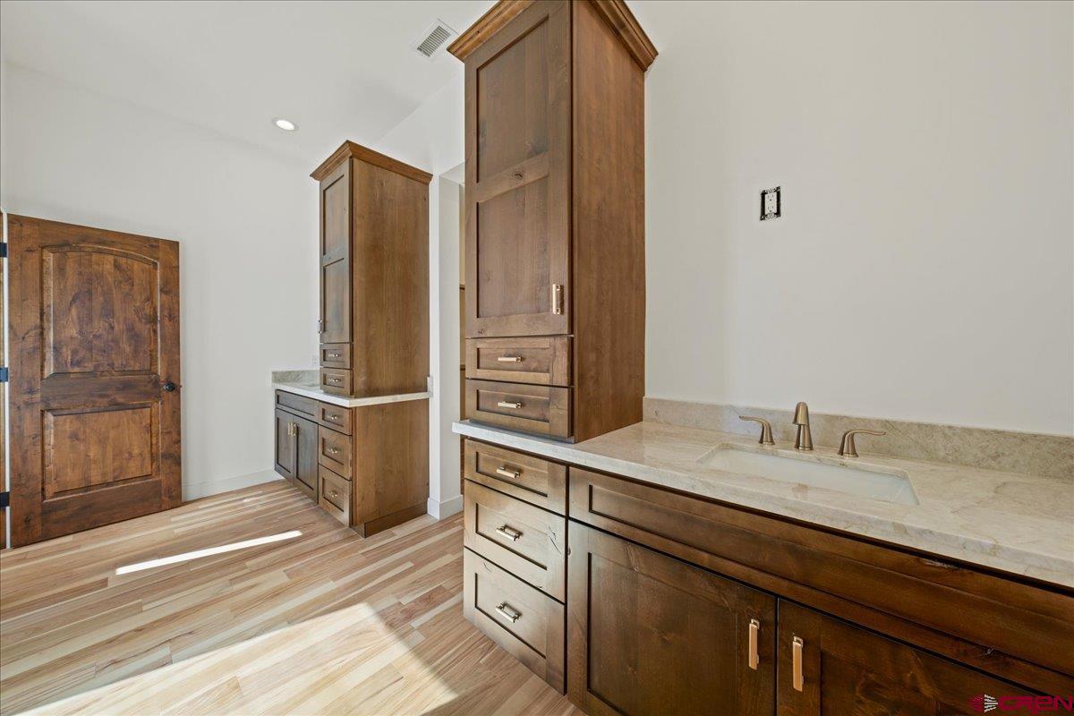 14447 5950 Road Montrose, CO 81403 - Photo 17 of 45 a bathroom with a sink and a mirror