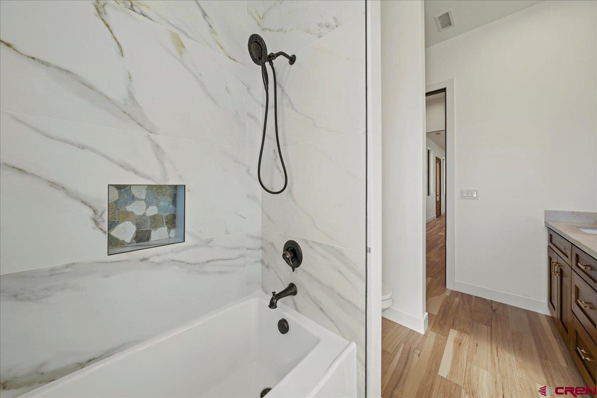 14447 5950 Road Montrose, CO 81403 - Photo 20 of 45 a bathroom with a bathtub