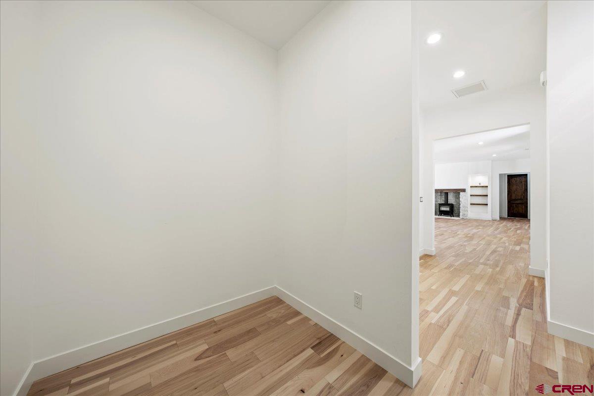 14447 5950 Road Montrose, CO 81403 - Photo 32 of 45 a view of a room with wooden floor