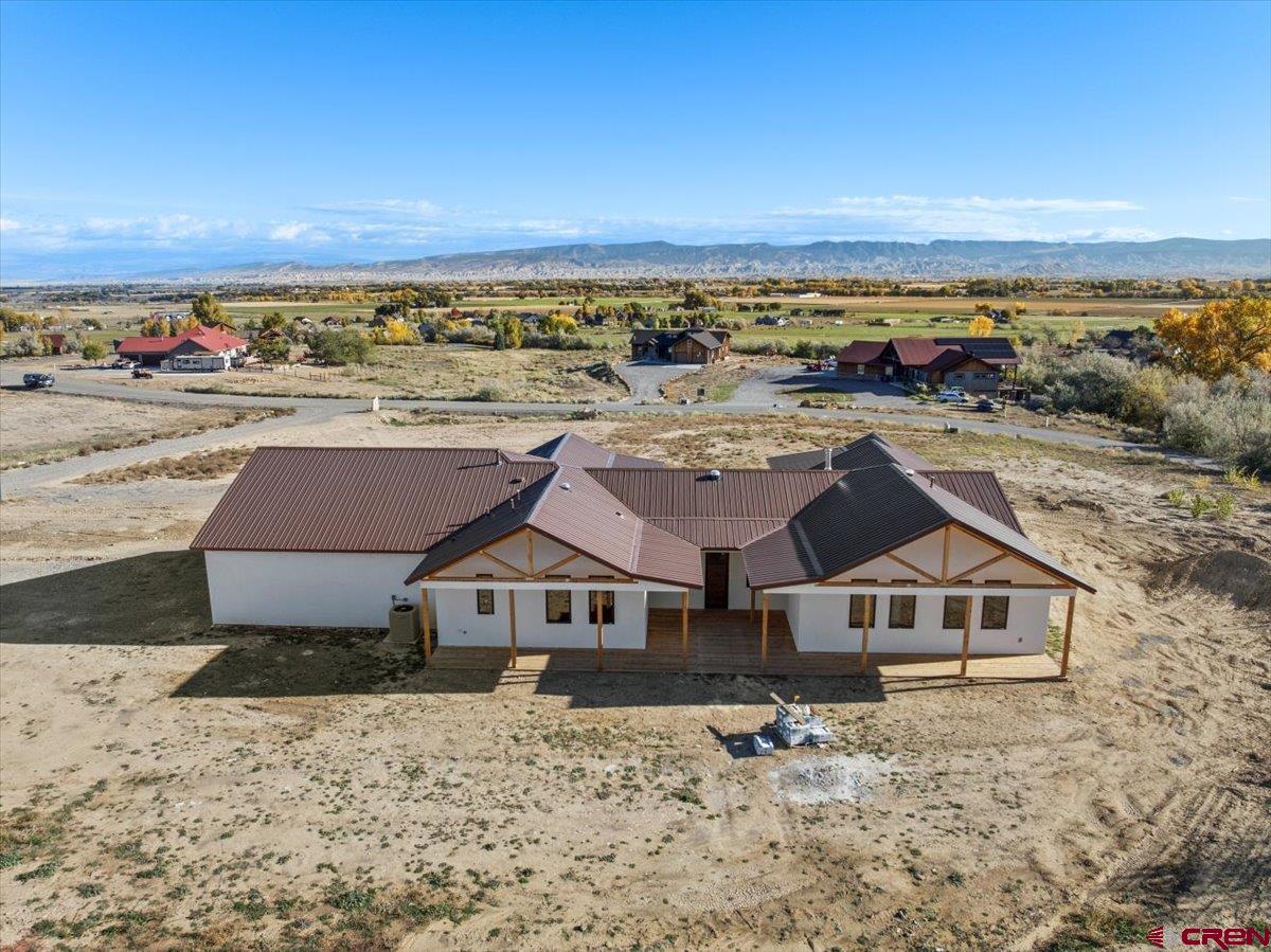 14447 5950 Road Montrose, CO 81403 - Photo 40 of 45 a aerial view of a house with a yard