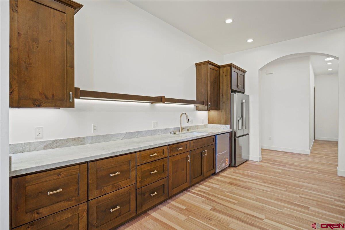 14447 5950 Road Montrose, CO 81403 - Photo 9 of 45 a spacious bathroom with a granite countertop sink and a mirror
