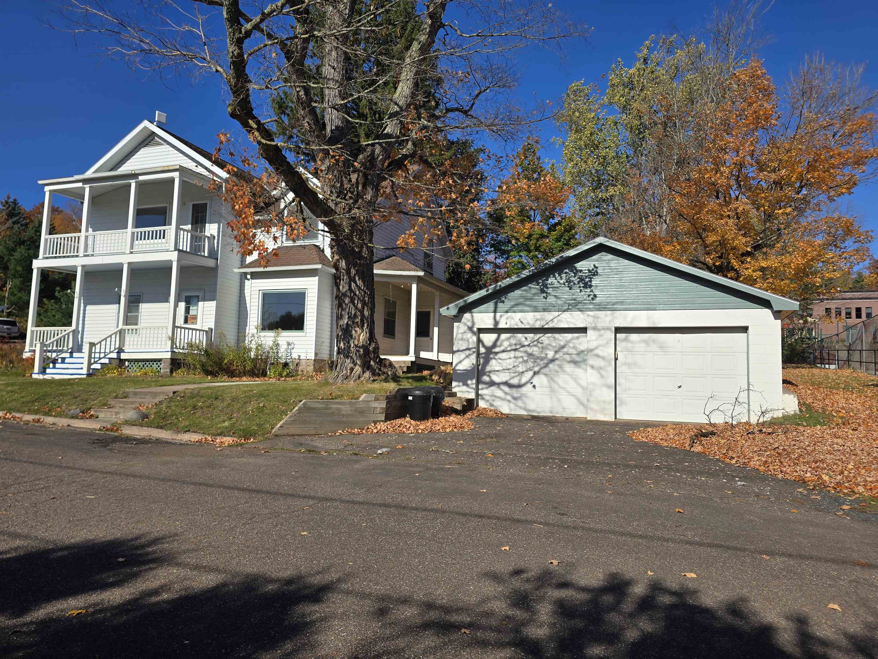 321 Rice Avenue Bayfield, WI 54814 - Photo 2 of 30 View of front of home with a balcony and a garage