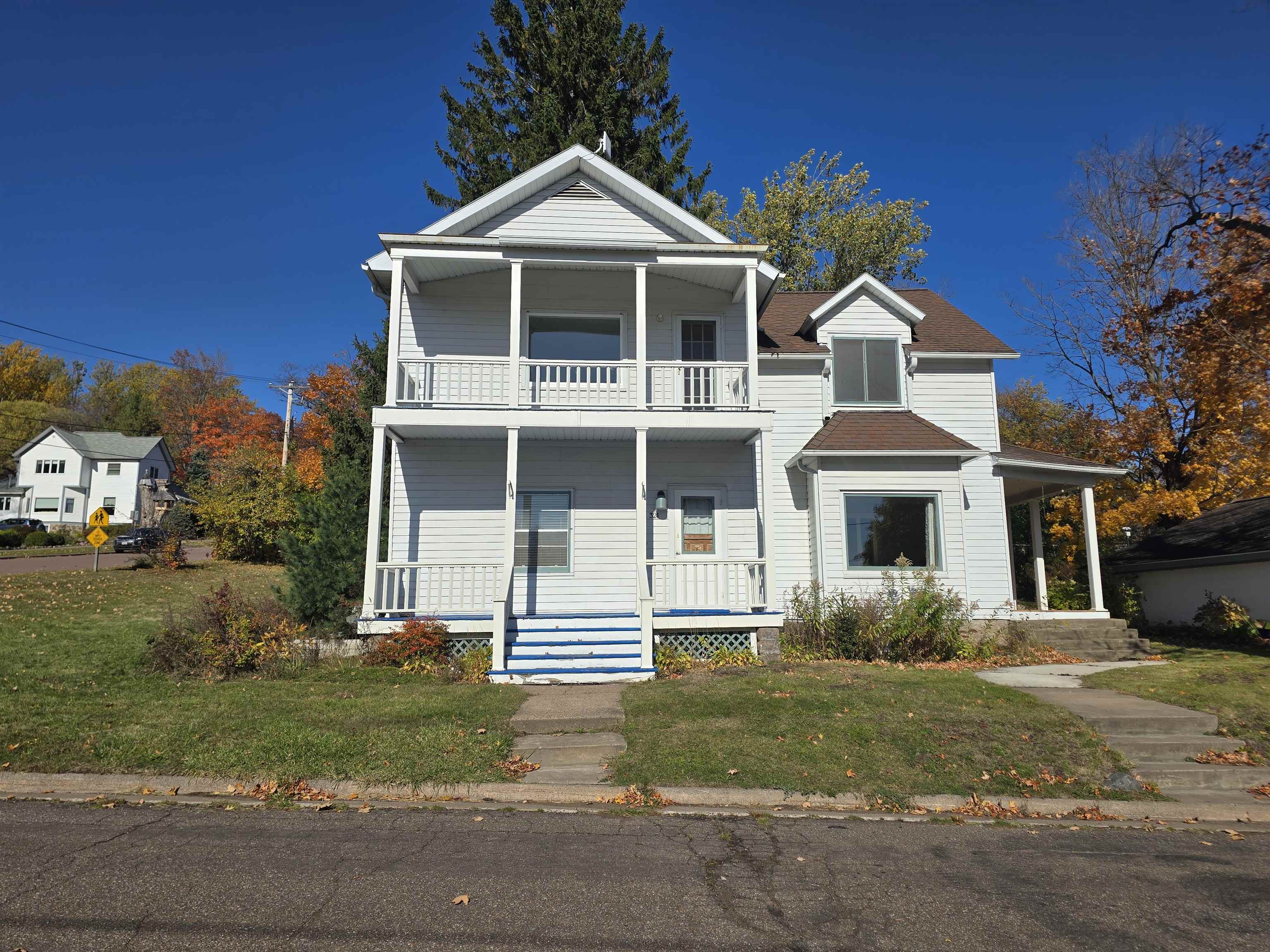321 Rice Avenue Bayfield, WI 54814 - Photo 4 of 30 View of front of house featuring a front yard and covered porch